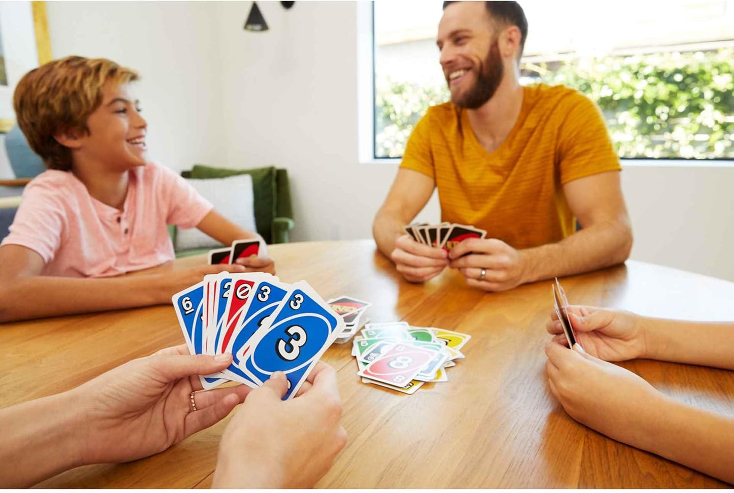 UNO Family Card Game, with 112 Cards in a Sturdy Storage Tin, Travel-Friendly, Makes a Great Game for 7 Year Olds and Up​